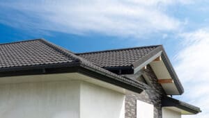 Metal roof tile with wave profile on modern house facade