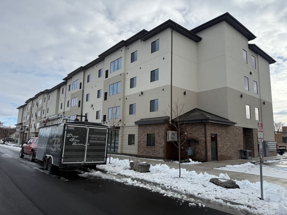 image2 Exterior of apartment complex with Design Gutter Systems parked out front